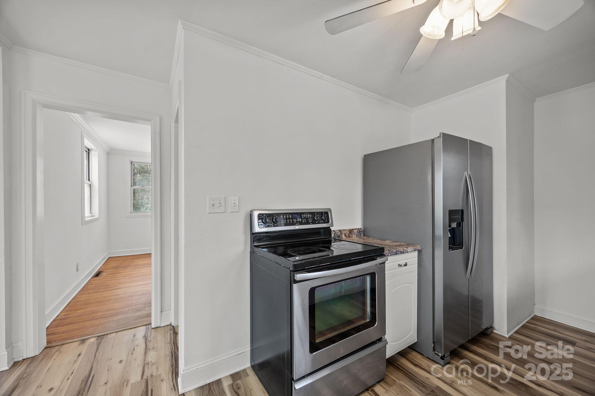 175 Chatham Road Asheville, NC 28804 - Photo 19 of 48 a kitchen with a refrigerator and stove
