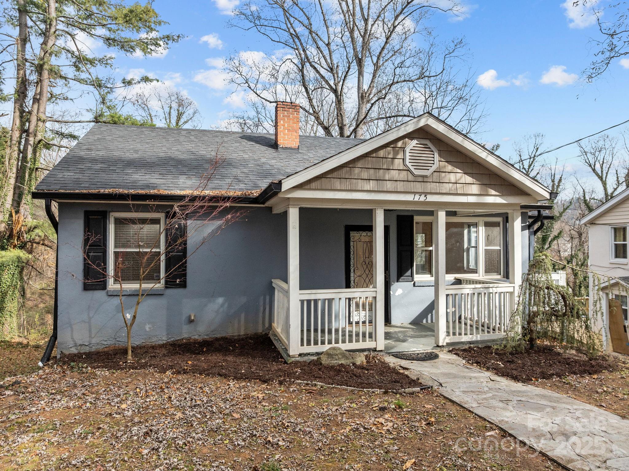 175 Chatham Road Asheville, NC 28804 - Photo 3 of 48 a front view of a house with a yard
