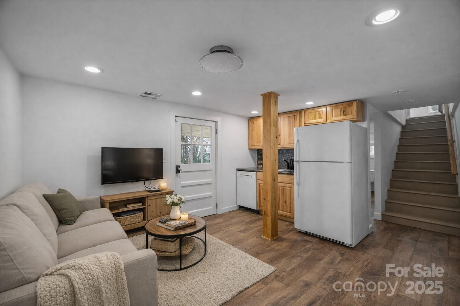 175 Chatham Road Asheville, NC 28804 - Photo 31 of 48 a living room with furniture and a flat screen tv