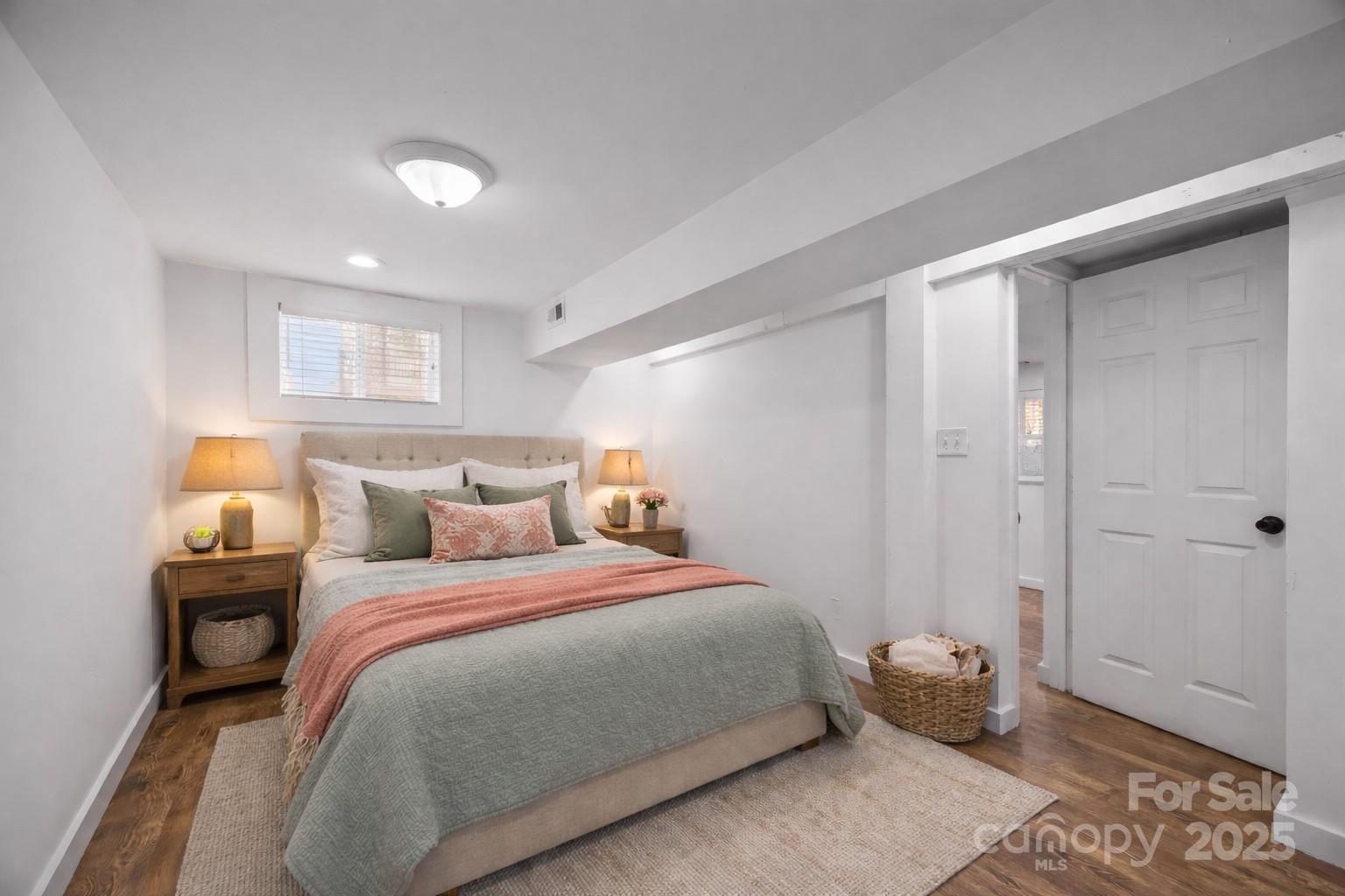 175 Chatham Road Asheville, NC 28804 - Photo 36 of 48 a bedroom with a bed and a window