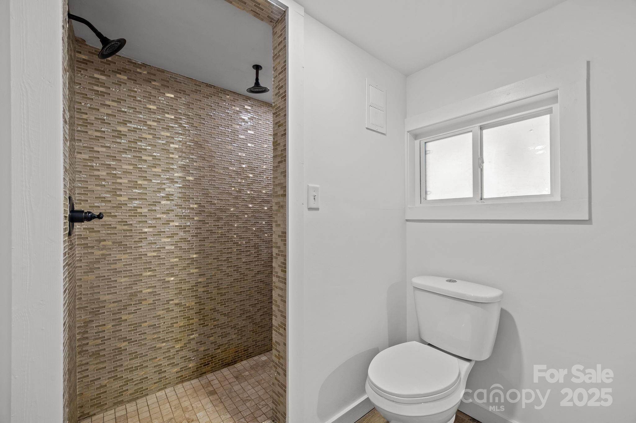 175 Chatham Road Asheville, NC 28804 - Photo 40 of 48 a bathroom with a toilet and a shower