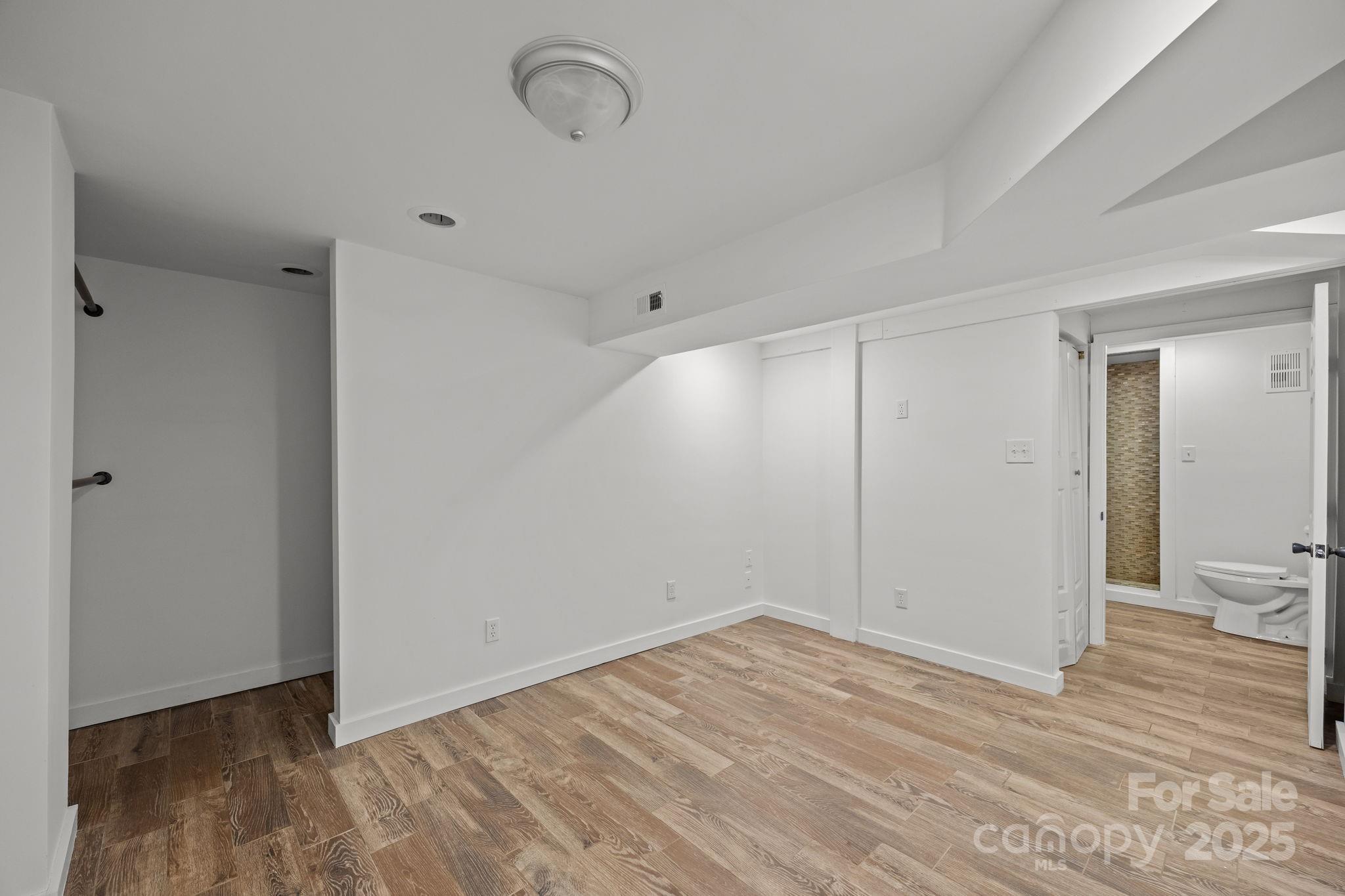 175 Chatham Road Asheville, NC 28804 - Photo 42 of 48 a view of a room with wooden floor and bathroom