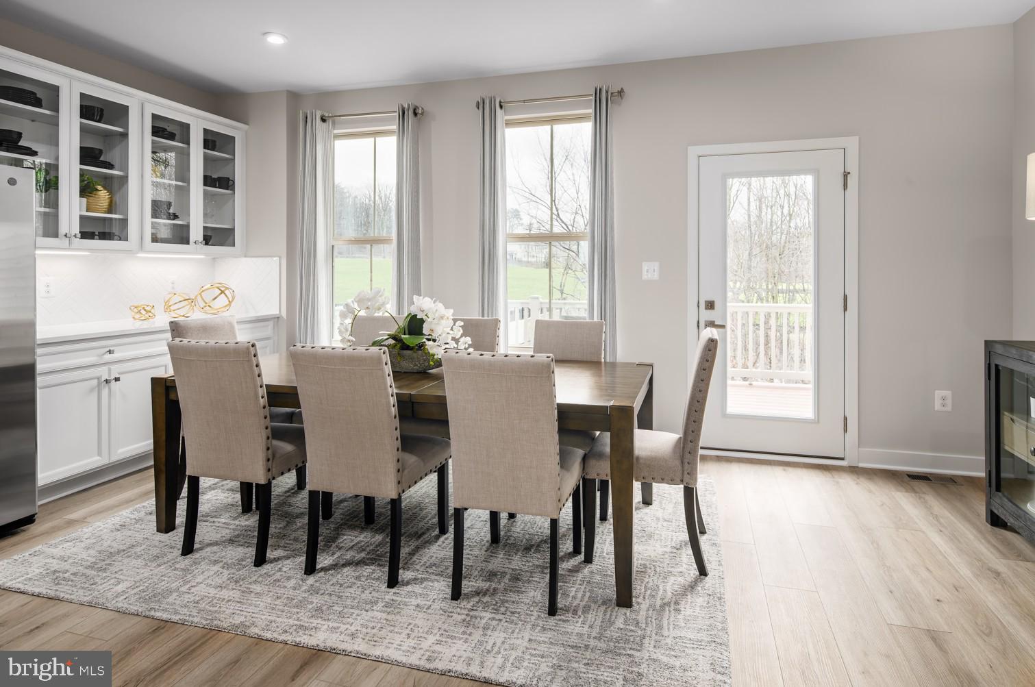 59 C Destrier Street Ranson, WV 25438 - Photo 8 of 17 a view of a dining room with furniture and wooden floor