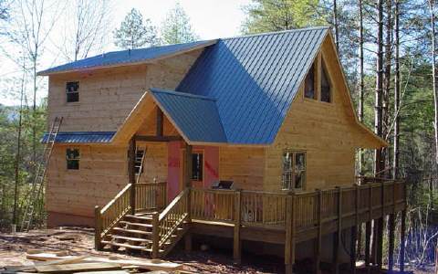a view of a house with a fence