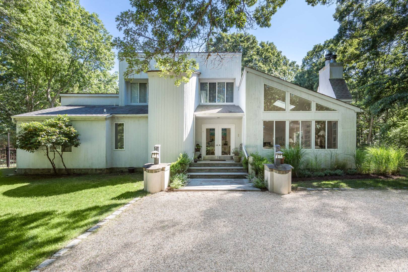 114 Neck Path East Hampton, NY 11937 - Photo 2 of 20 a front view of a house with garden
