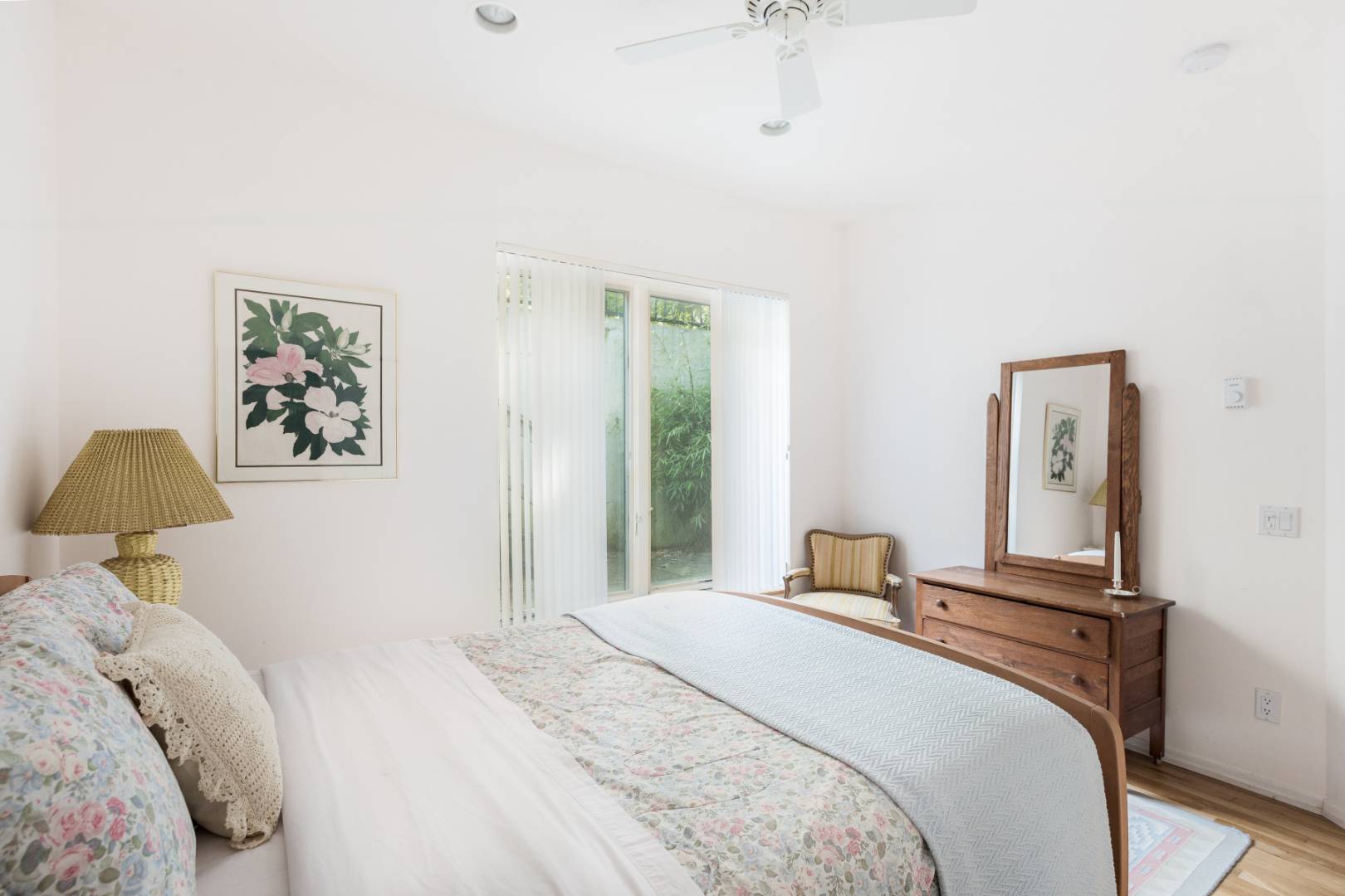 114 Neck Path East Hampton, NY 11937 - Photo 12 of 20 a bedroom with a large bed and a chandelier