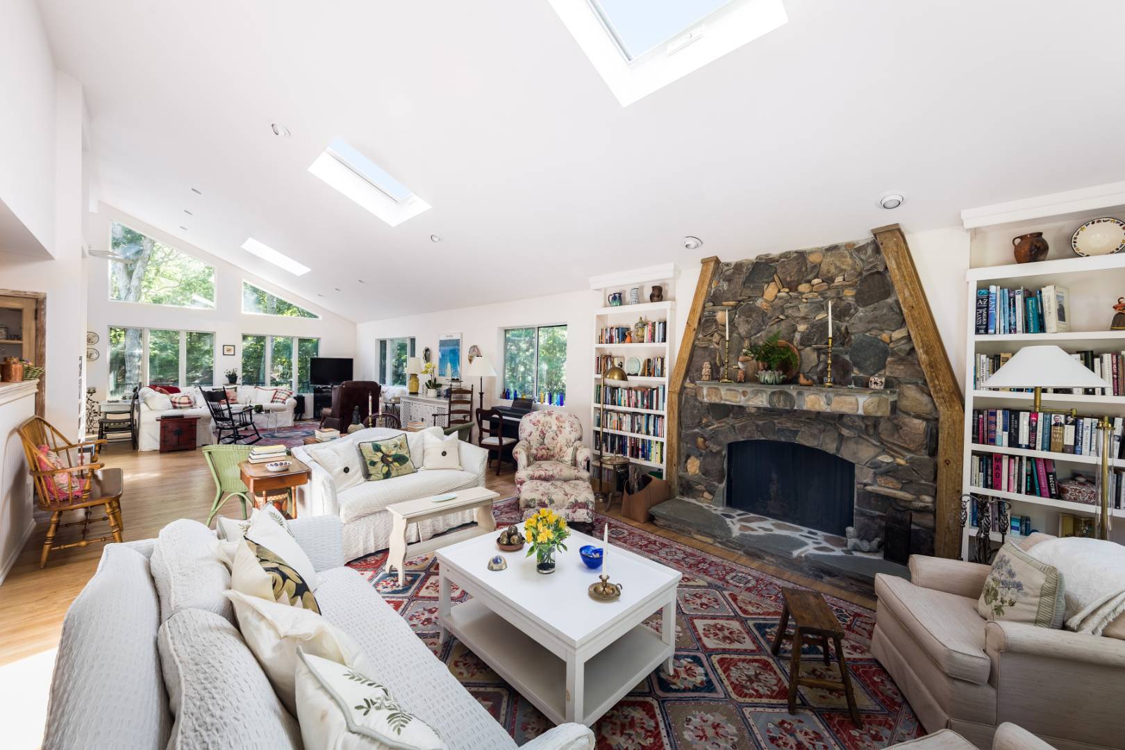 114 Neck Path East Hampton, NY 11937 - Photo 4 of 20 a living room with furniture fireplace and book shelf