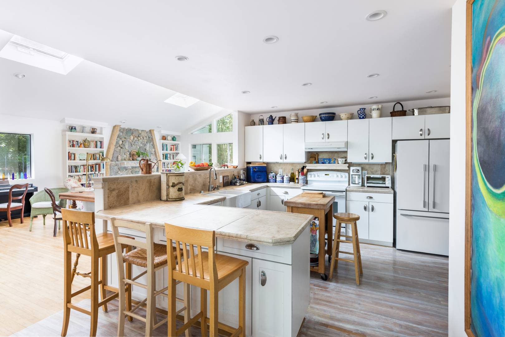 114 Neck Path East Hampton, NY 11937 - Photo 5 of 20 a kitchen with stainless steel appliances a table chairs and a refrigerator