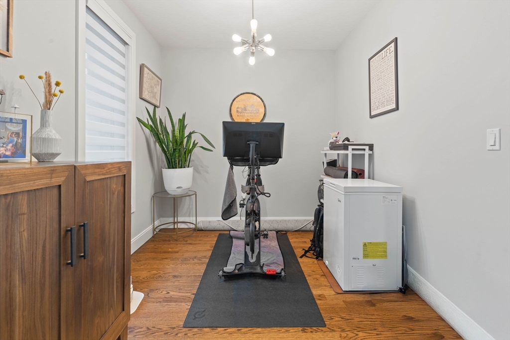 6 Ashland Street, Unit 3 Boston, MA 02122 - Photo 11 of 25 a living room with furniture and wooden floor