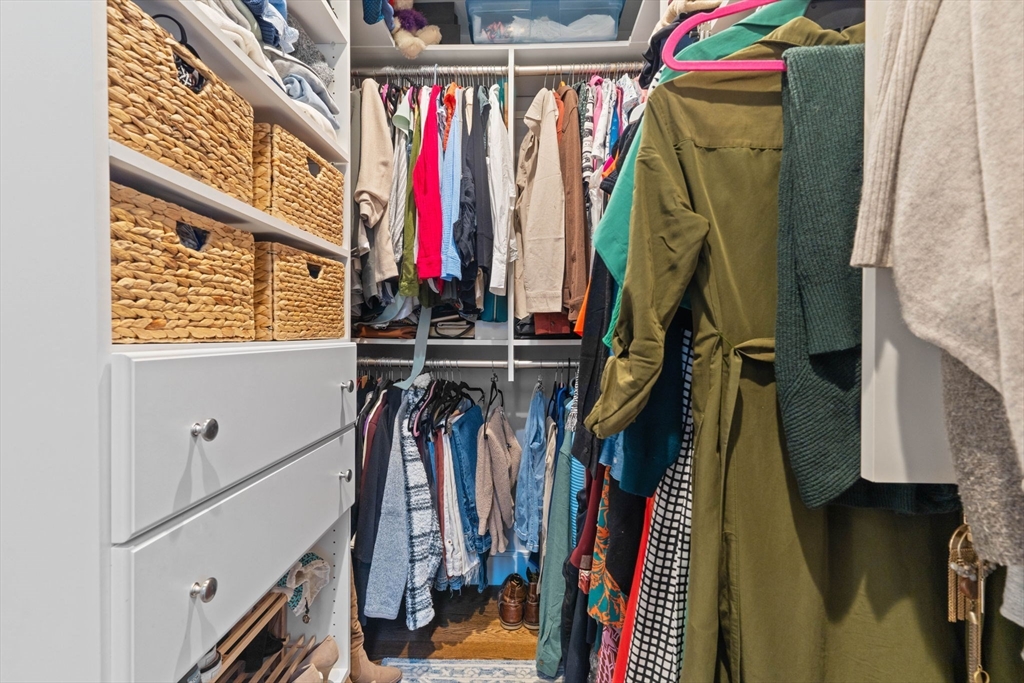 6 Ashland Street, Unit 3 Boston, MA 02122 - Photo 15 of 25 a view of walk in closet with clothes and shoes