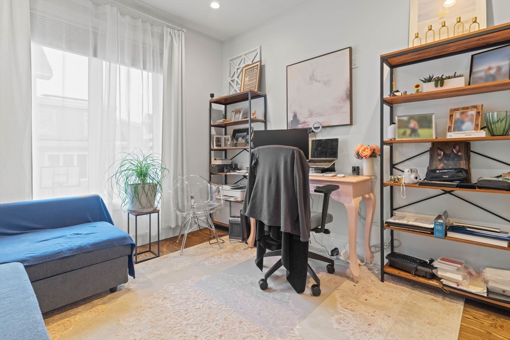6 Ashland Street, Unit 3 Boston, MA 02122 - Photo 19 of 25 a view of a livingroom with furniture and a window