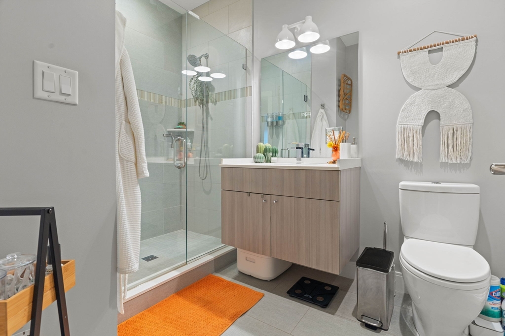 6 Ashland Street, Unit 3 Boston, MA 02122 - Photo 20 of 25 a bathroom with a toilet sink and shower
