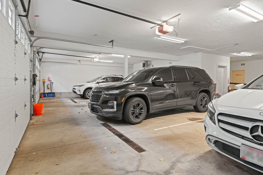 6 Ashland Street, Unit 3 Boston, MA 02122 - Photo 24 of 25 a view of parking garage with cars parked