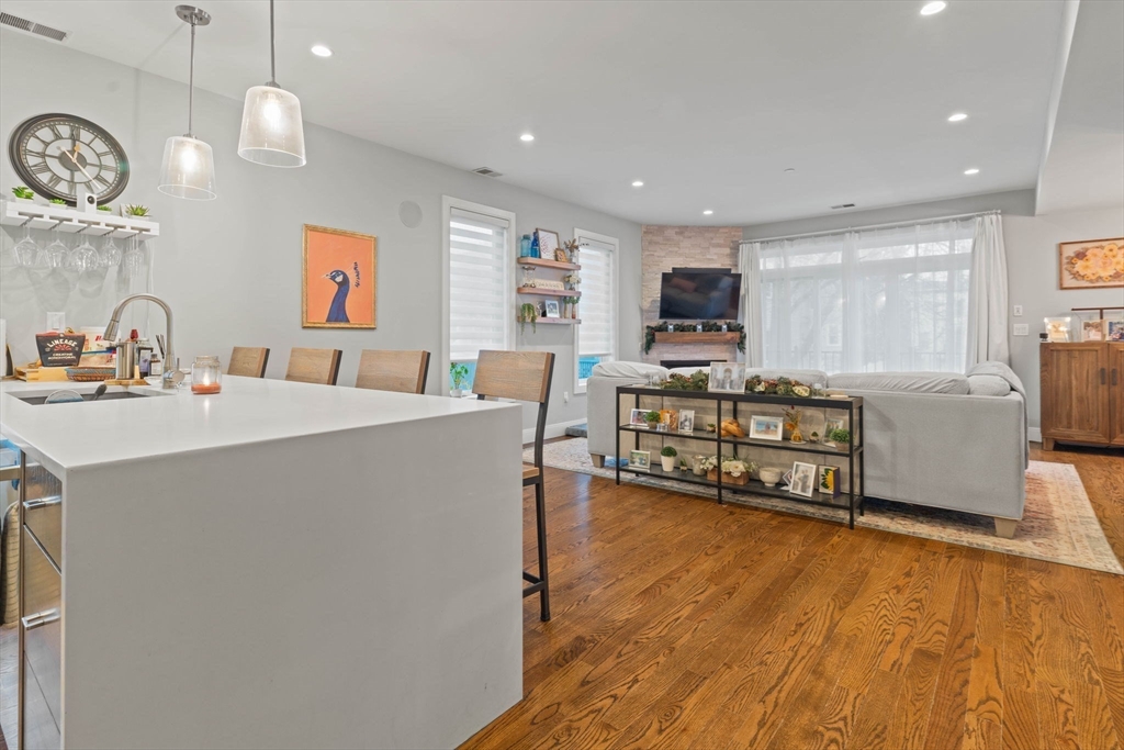 6 Ashland Street, Unit 3 Boston, MA 02122 - Photo 3 of 25 a living room with furniture and a flat screen tv