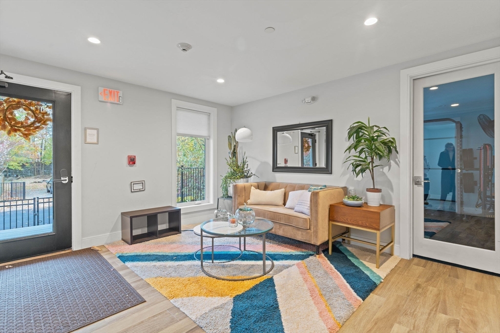 6 Ashland Street, Unit 3 Boston, MA 02122 - Photo 8 of 25 a living room with furniture and a fireplace