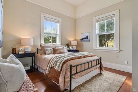 a bedroom with bed and a window