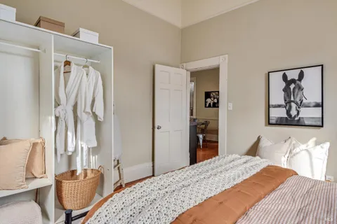 a bedroom with a bed and a couch