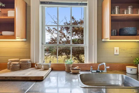 a en suite bathroom with a granite countertop tub and a sink