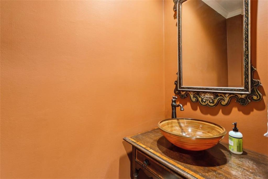 650 Moores Mill Road Northwest, Unit 19 Atlanta, GA 30327 - Photo 26 of 48 a bathroom with a toilet and a mirror