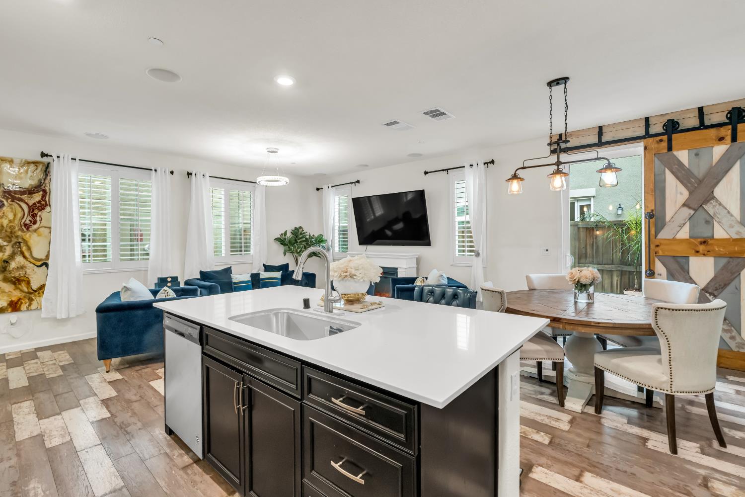 8193 Kramer Ranch Way Elk Grove, CA 95758 - Photo 15 of 48 a kitchen with a stove a sink a dining table and chairs