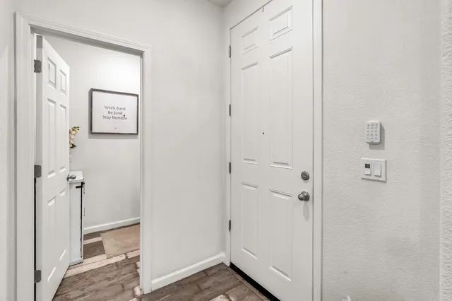 a view of a bathroom from a hallway