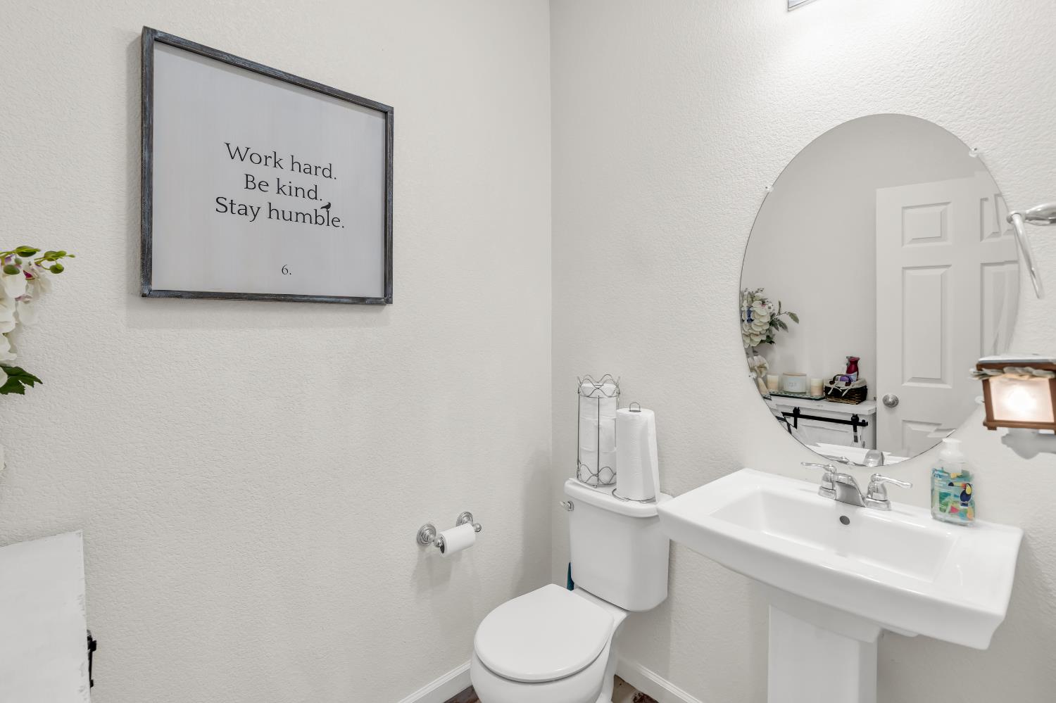 8193 Kramer Ranch Way Elk Grove, CA 95758 - Photo 20 of 48 a bathroom with a toilet sink and mirror