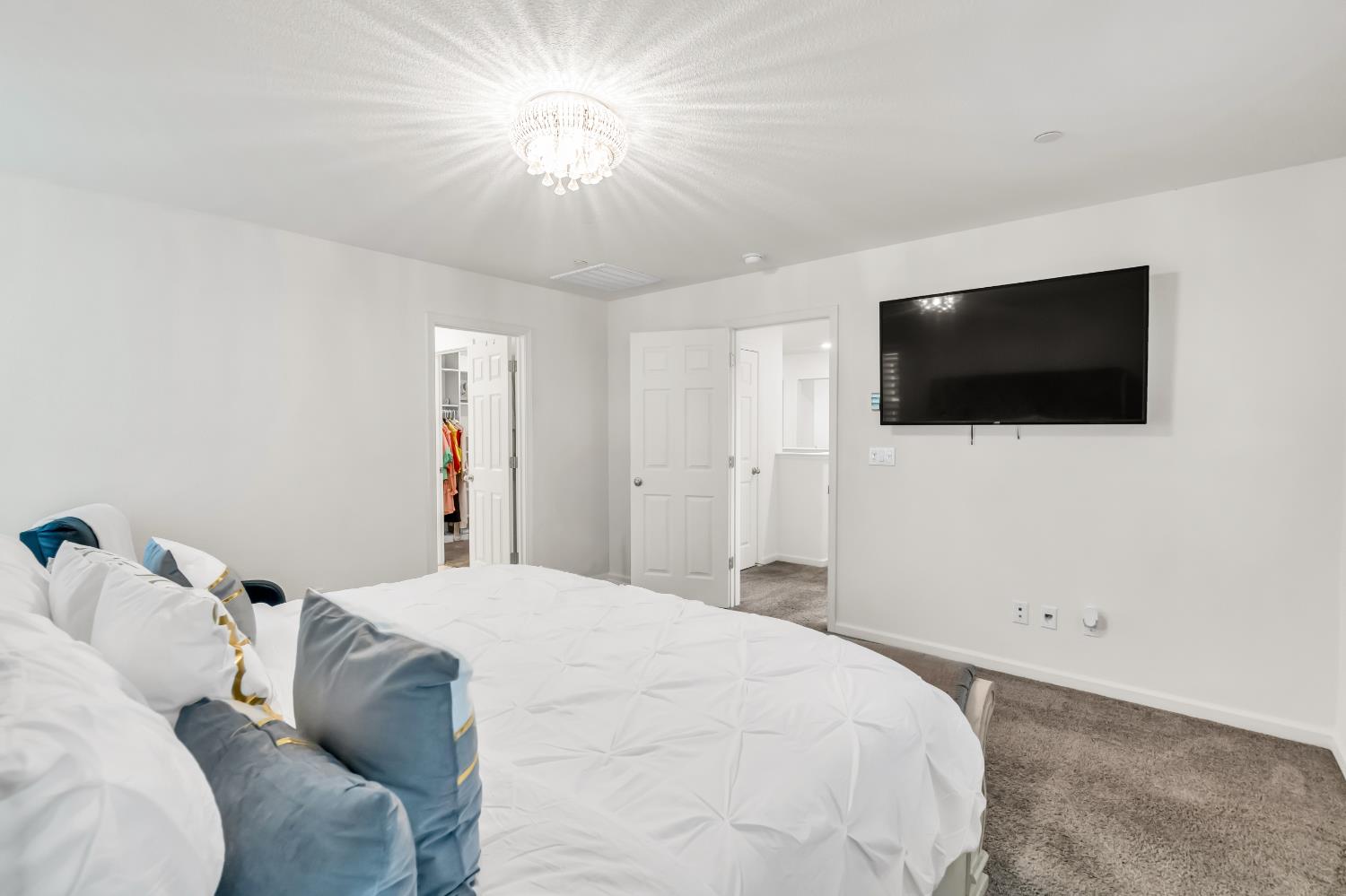 8193 Kramer Ranch Way Elk Grove, CA 95758 - Photo 29 of 48 a bedroom with a bed and a flat screen tv