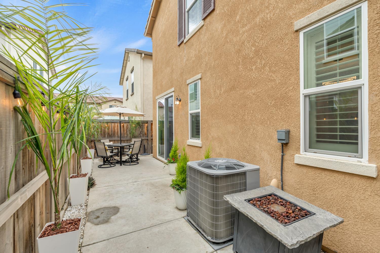 8193 Kramer Ranch Way Elk Grove, CA 95758 - Photo 34 of 48 a view of a patio with table and chairs and potted plants