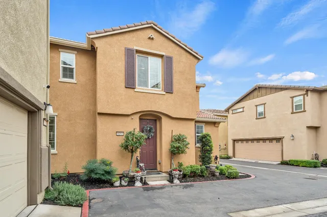 a front view of a house with a garage
