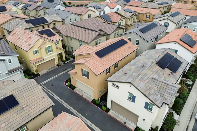 an aerial view of a house with a city view