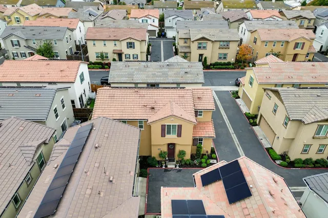 an aerial view of a house with outdoor space