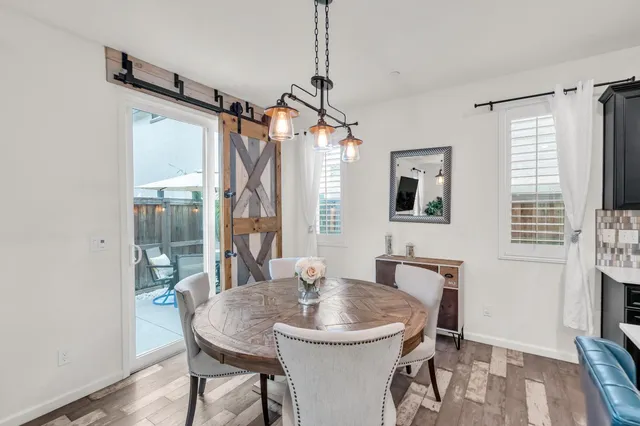 a dining room with furniture and window