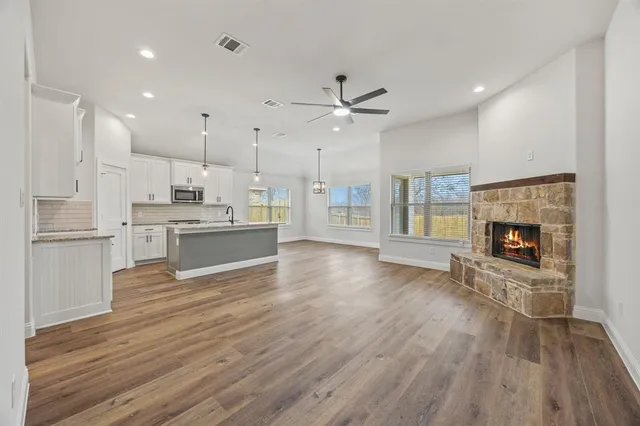 a view of kitchen with cabinets and wooden floor