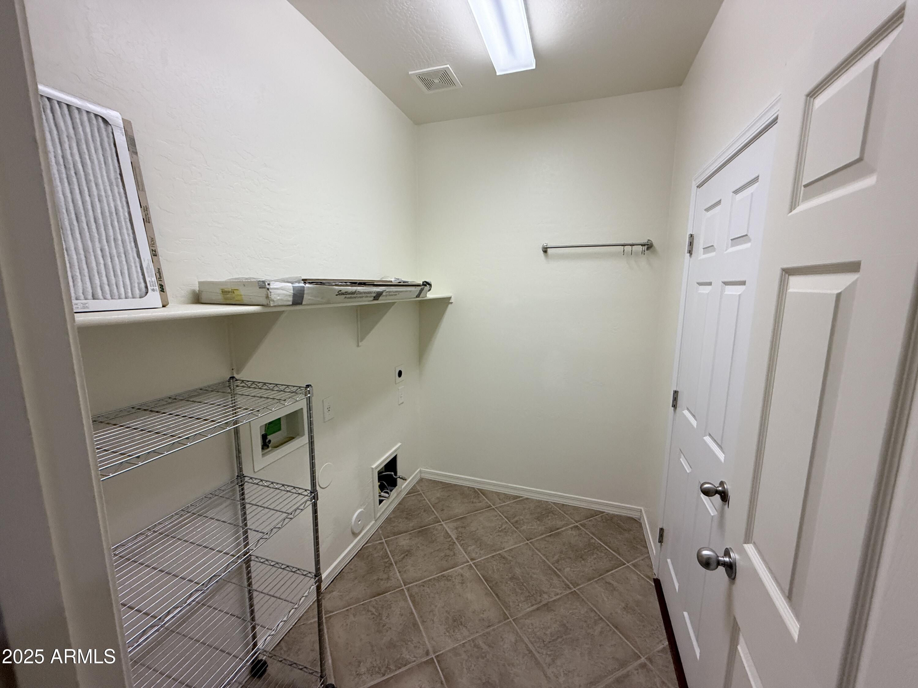16549 West Rowel Road Surprise, AZ 85387 - Photo 19 of 23 a view of a walk in closet