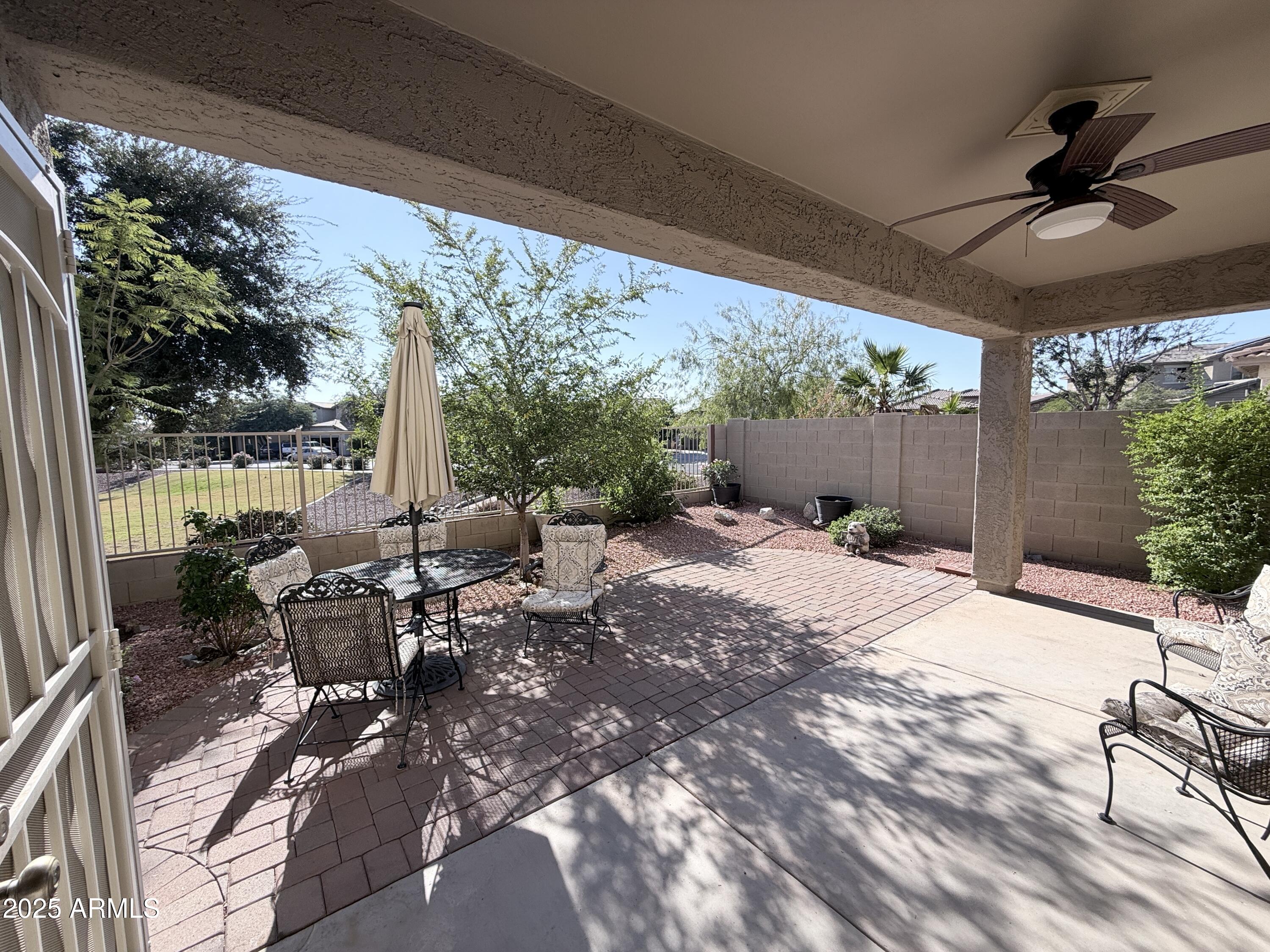16549 West Rowel Road Surprise, AZ 85387 - Photo 20 of 23 a view of a backyard with sitting area