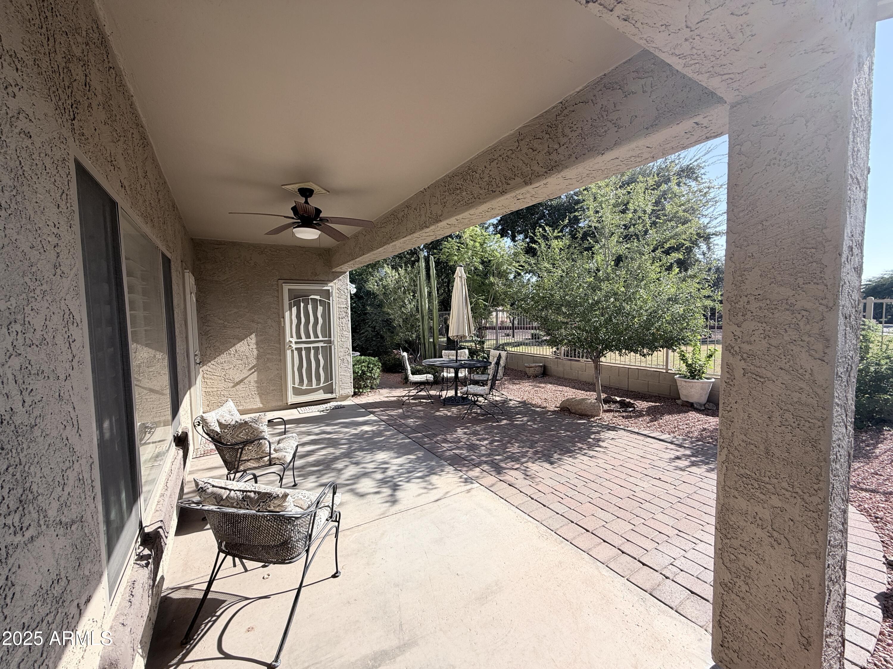 16549 West Rowel Road Surprise, AZ 85387 - Photo 21 of 23 a view of a porch with furniture and floor to ceiling window