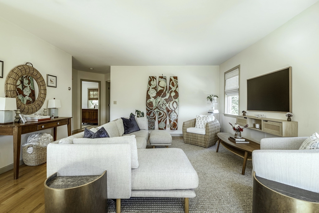 28 Elm Street, Unit 3 Manchester, MA 01944 - Photo 1 of 20 a living room with furniture and a flat screen tv