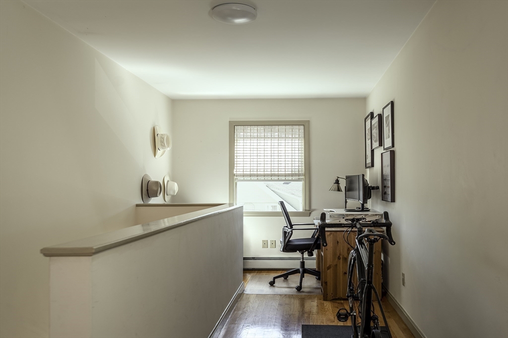 28 Elm Street, Unit 3 Manchester, MA 01944 - Photo 11 of 20 a view of a workspace with furniture and a window