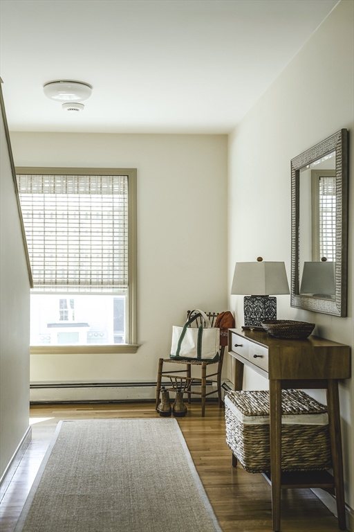 28 Elm Street, Unit 3 Manchester, MA 01944 - Photo 13 of 20 a living room with furniture and a window