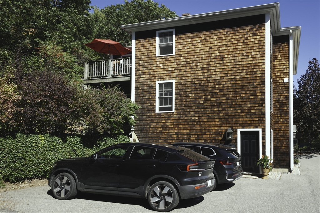 28 Elm Street, Unit 3 Manchester, MA 01944 - Photo 16 of 20 a car parked in front of a house