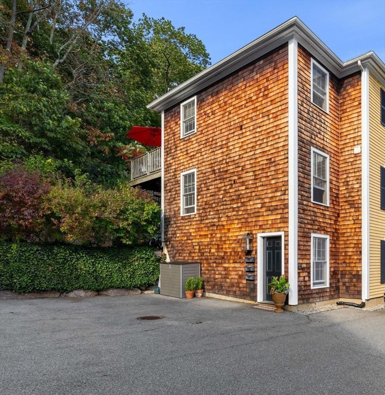 28 Elm Street, Unit 3 Manchester, MA 01944 - Photo 2 of 20 a front view of a house with a yard