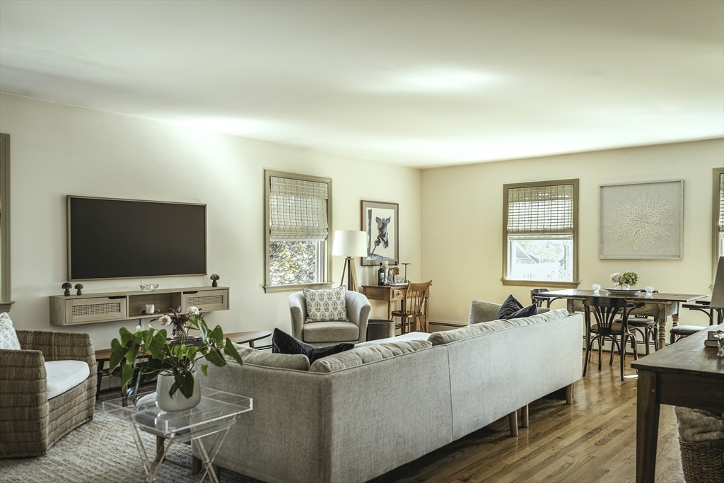 28 Elm Street, Unit 3 Manchester, MA 01944 - Photo 4 of 20 a living room with furniture and a flat screen tv