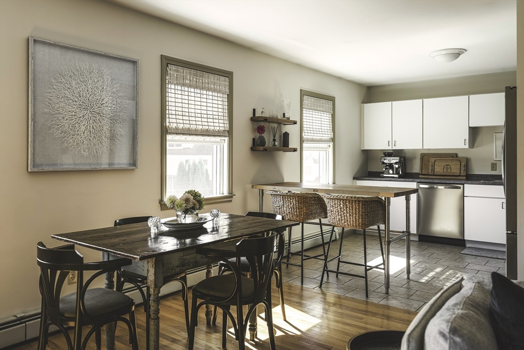 28 Elm Street, Unit 3 Manchester, MA 01944 - Photo 5 of 20 a view of a dining room with furniture and wooden floor