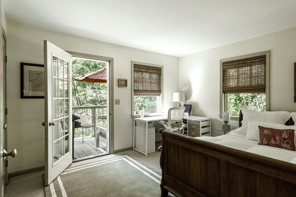 28 Elm Street, Unit 3 Manchester, MA 01944 - Photo 7 of 20 a kitchen with granite countertop a stove a sink and a refrigerator