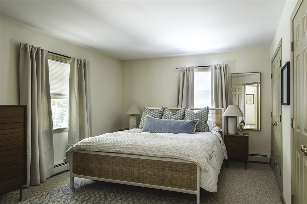 28 Elm Street, Unit 3 Manchester, MA 01944 - Photo 8 of 20 a bedroom with a bed and a window