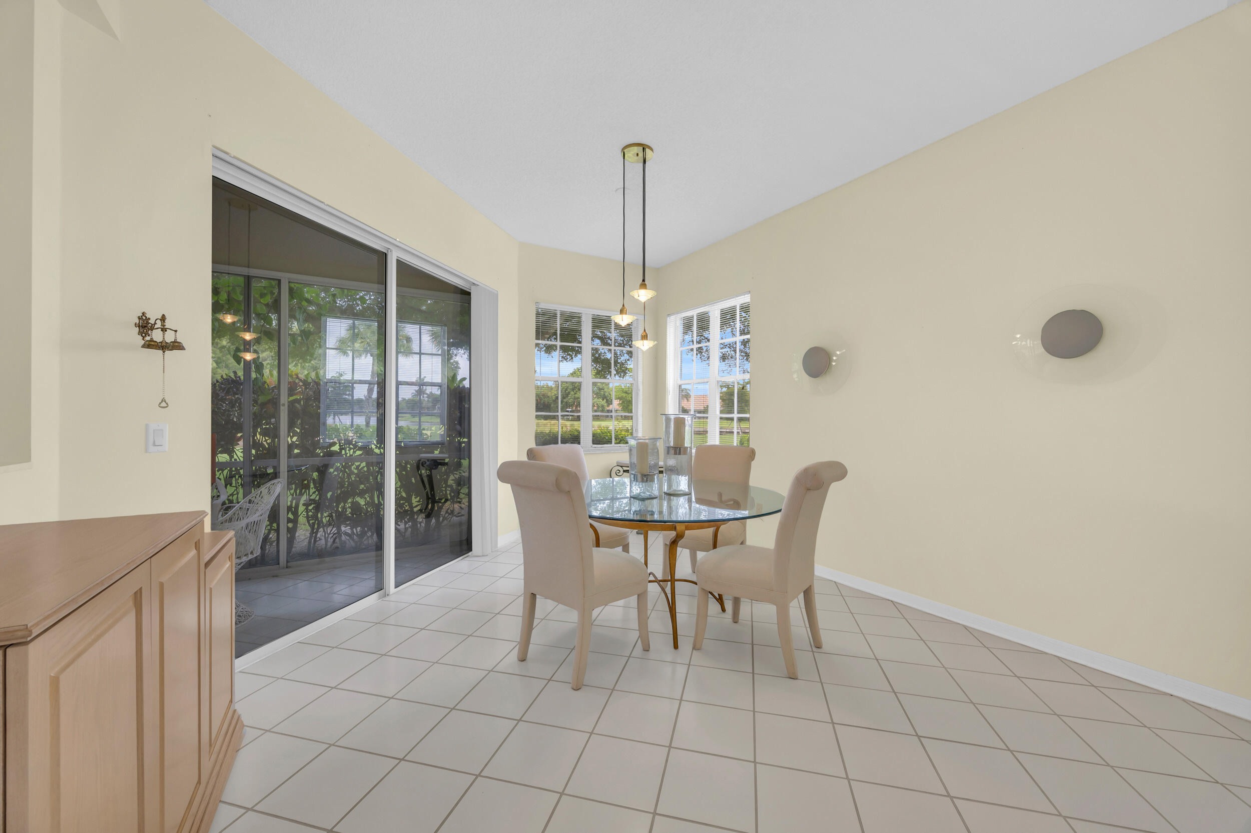 10172 Andover Coach Circle, Unit G2 Lake Worth, FL 33449 - Photo 13 of 64 a dining room with furniture and window