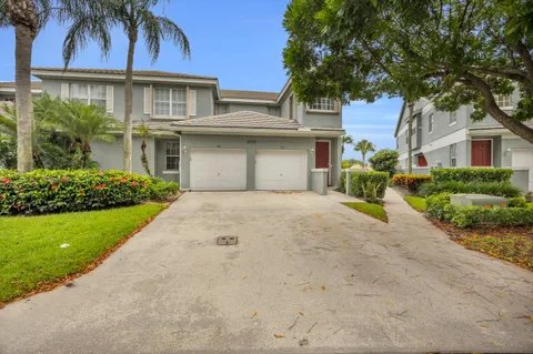 front view of a house with a garden