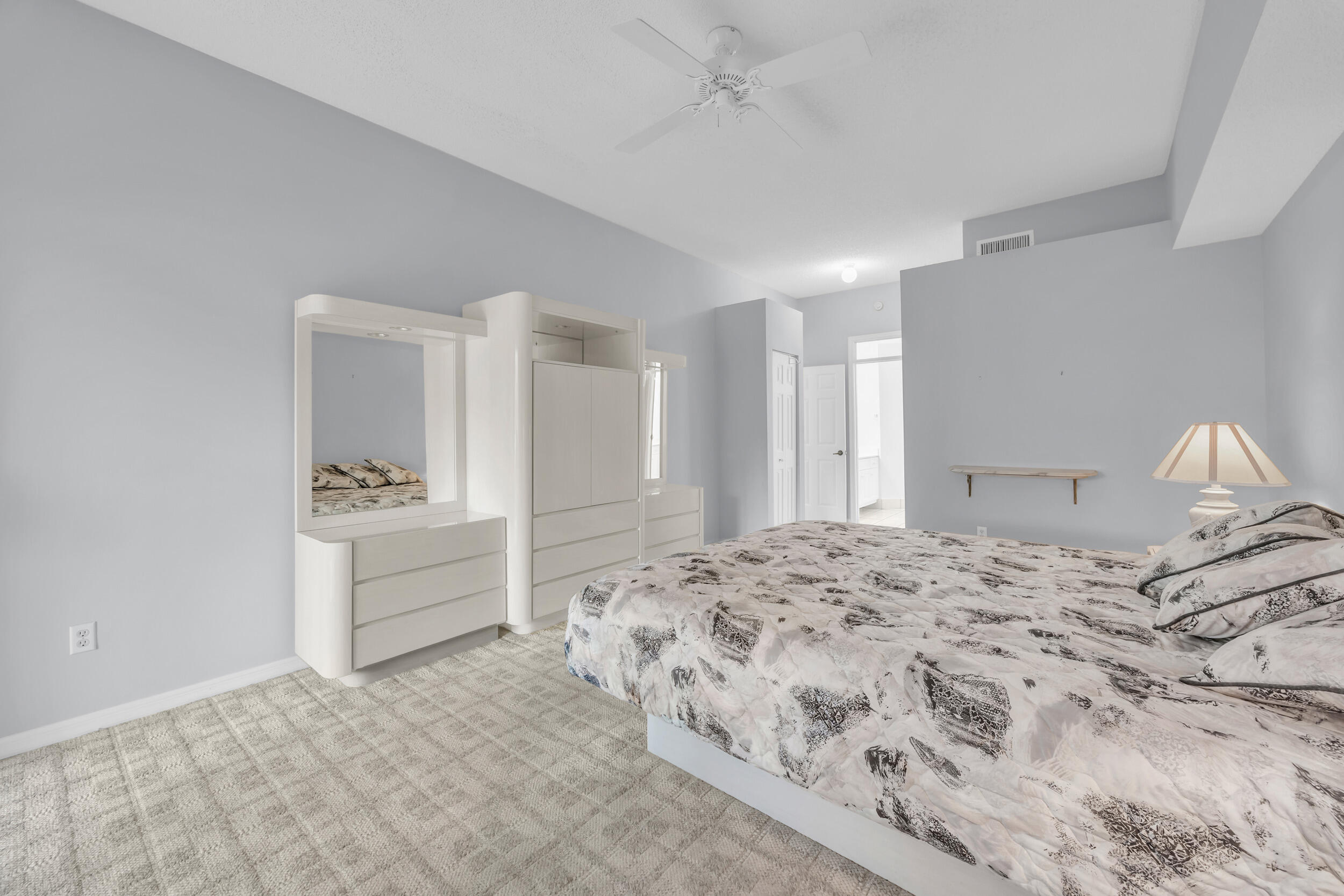 10172 Andover Coach Circle, Unit G2 Lake Worth, FL 33449 - Photo 23 of 64 a bedroom with a bed and a view of bathroom