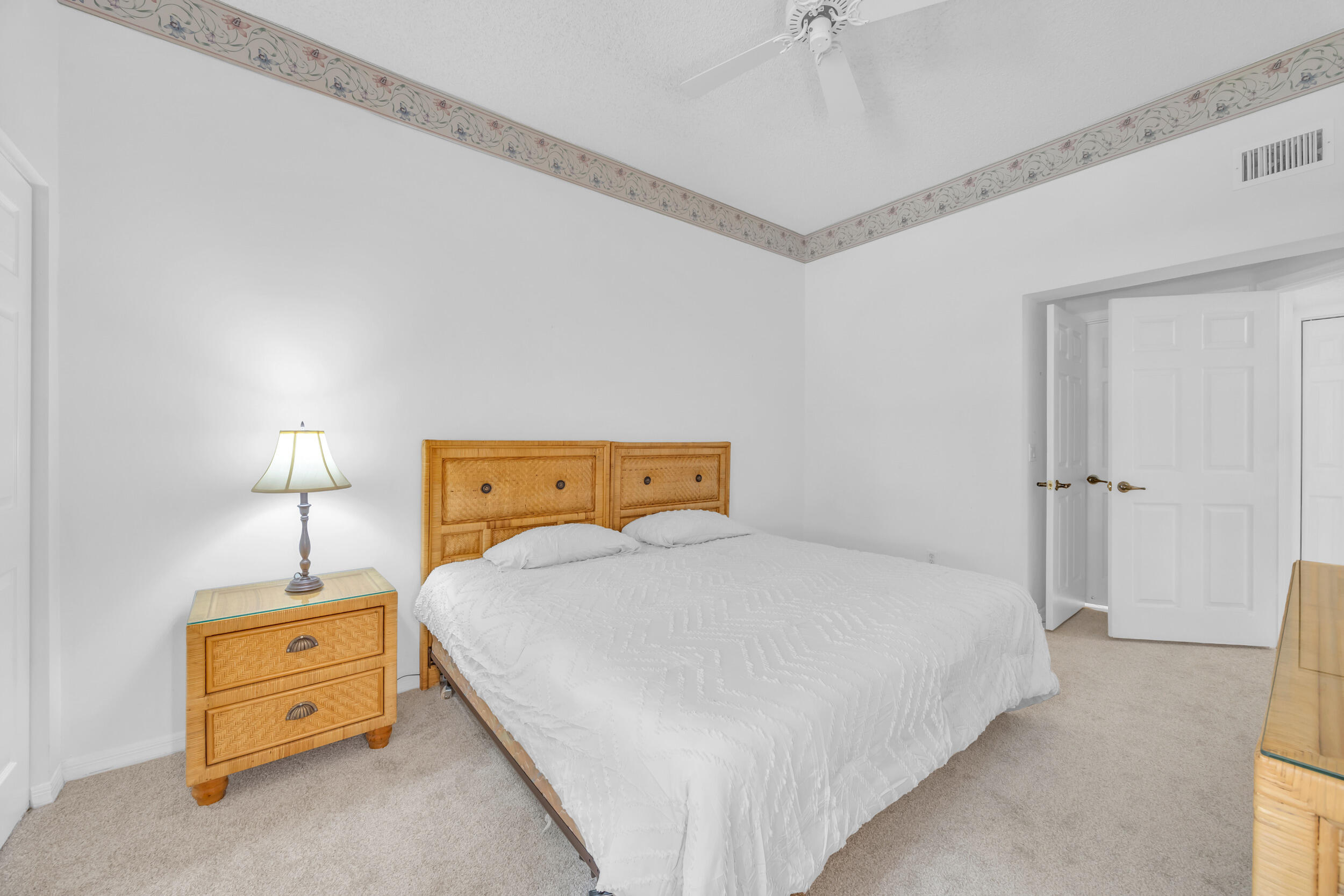 10172 Andover Coach Circle, Unit G2 Lake Worth, FL 33449 - Photo 29 of 64 a bedroom with a bed and a dresser