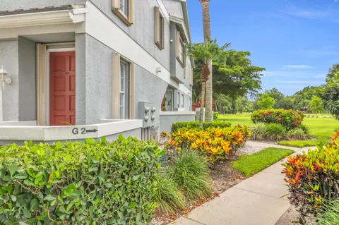 a view of a house with a backyard and garden